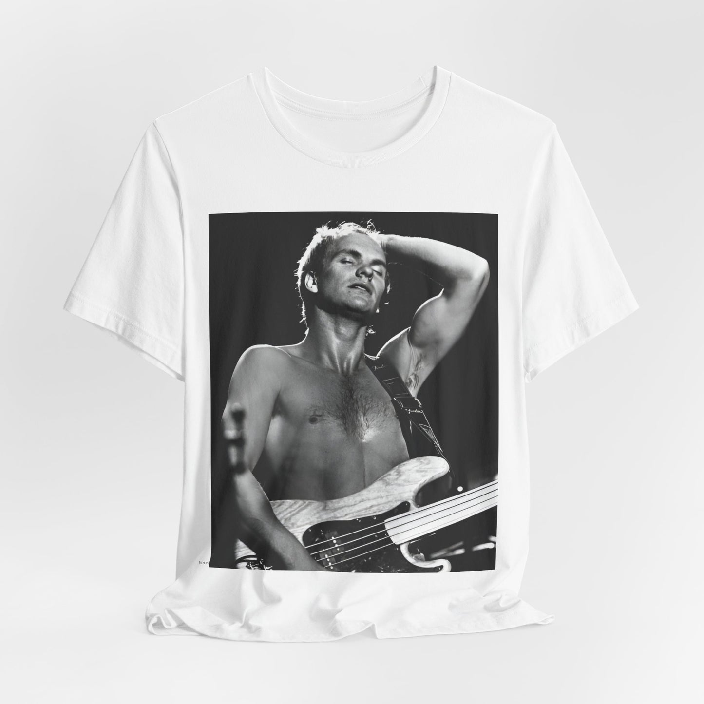 A black graphic t-shirt featuring a graphic or photo of Sting performing live on stage in 1983.