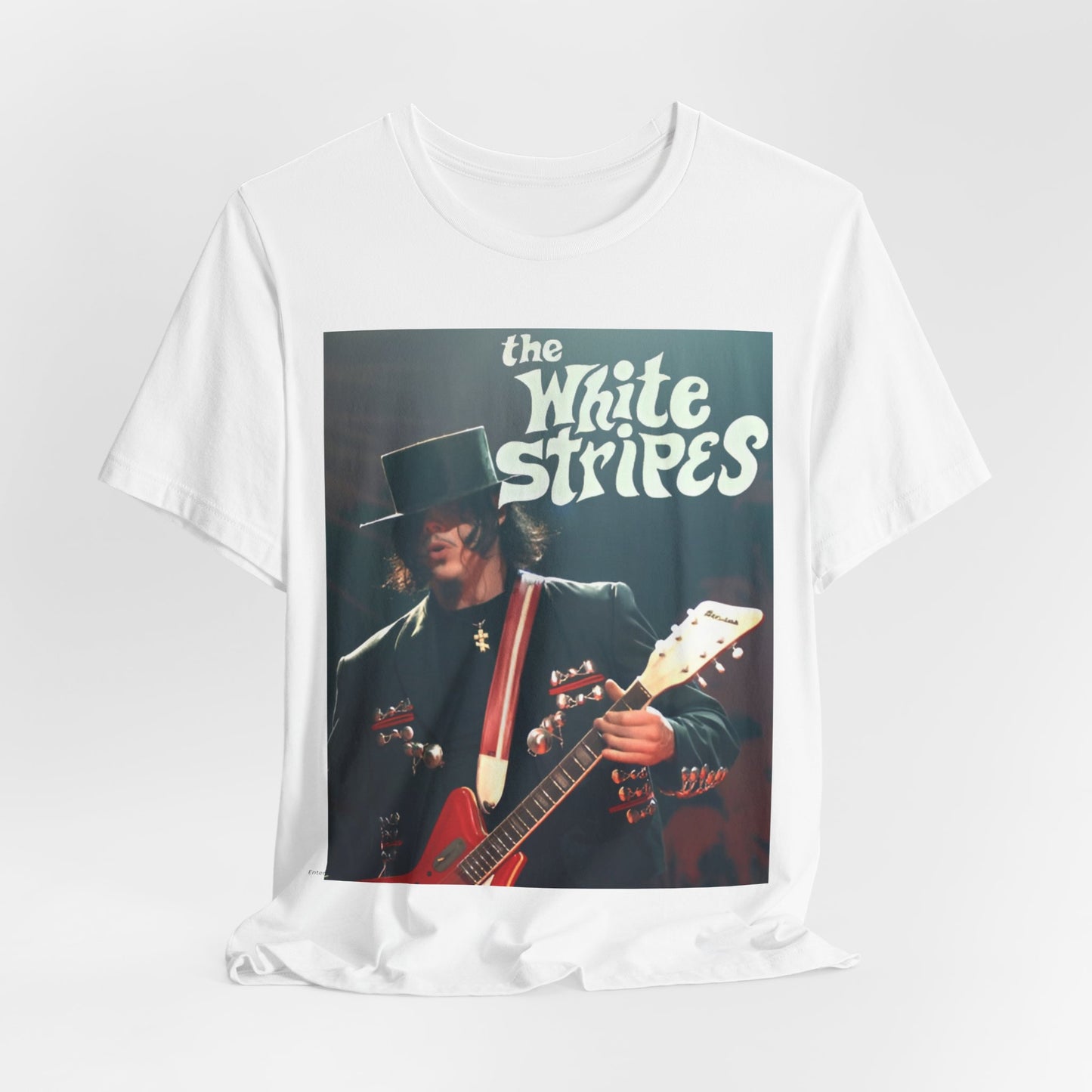 A black graphic t-shirt featuring a graphic of Jack White from The White Stripes as a guitar god.