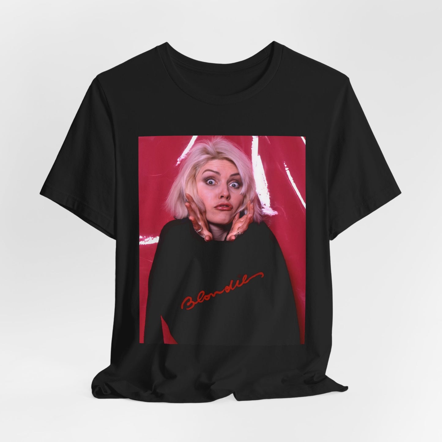 A black graphic t-shirt featuring a graphic related to Blondie's 'Atomic' song or era.