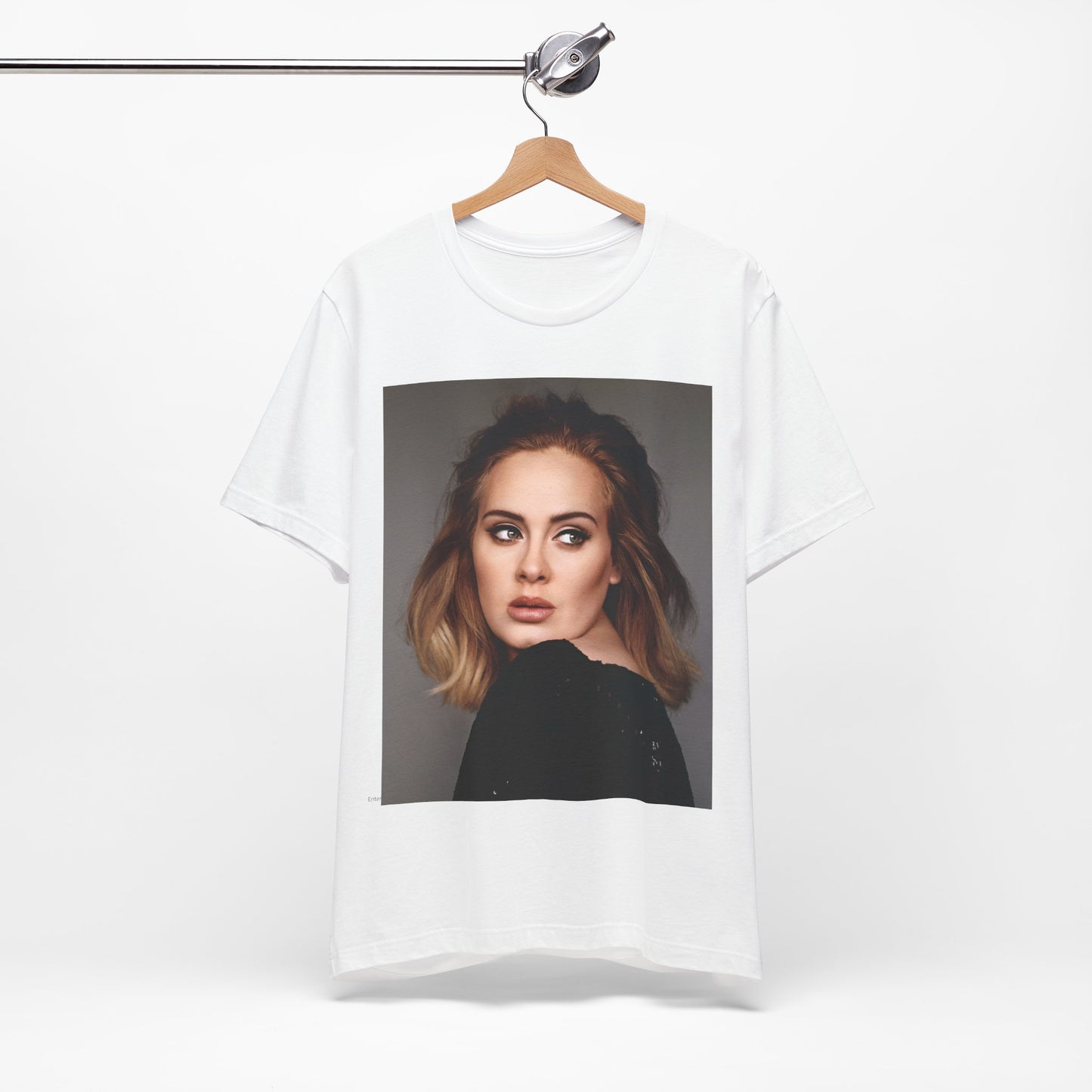 A black graphic t-shirt featuring a studio portrait of Adele from her '25' album era, showing a thoughtful or serene expression.