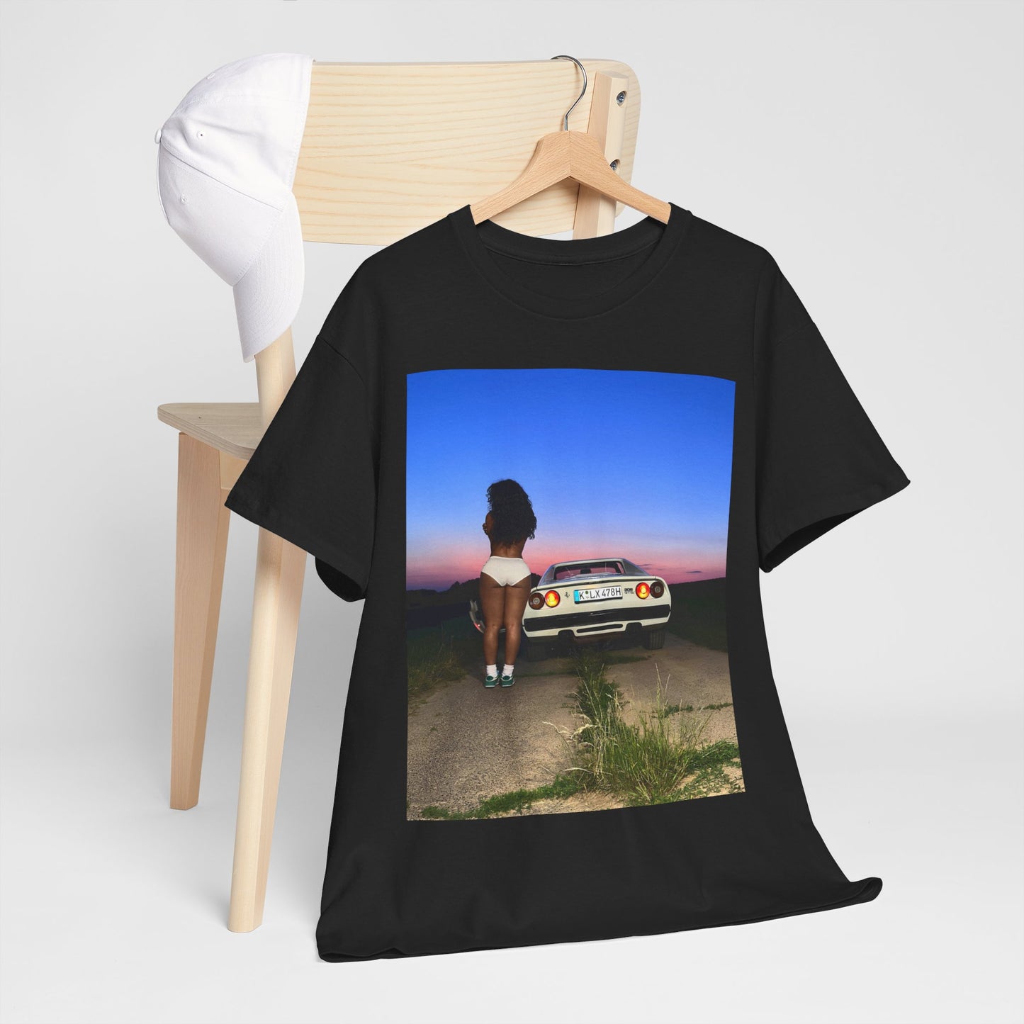 A black graphic t-shirt featuring a vintage alt R&B graphic of SZA.