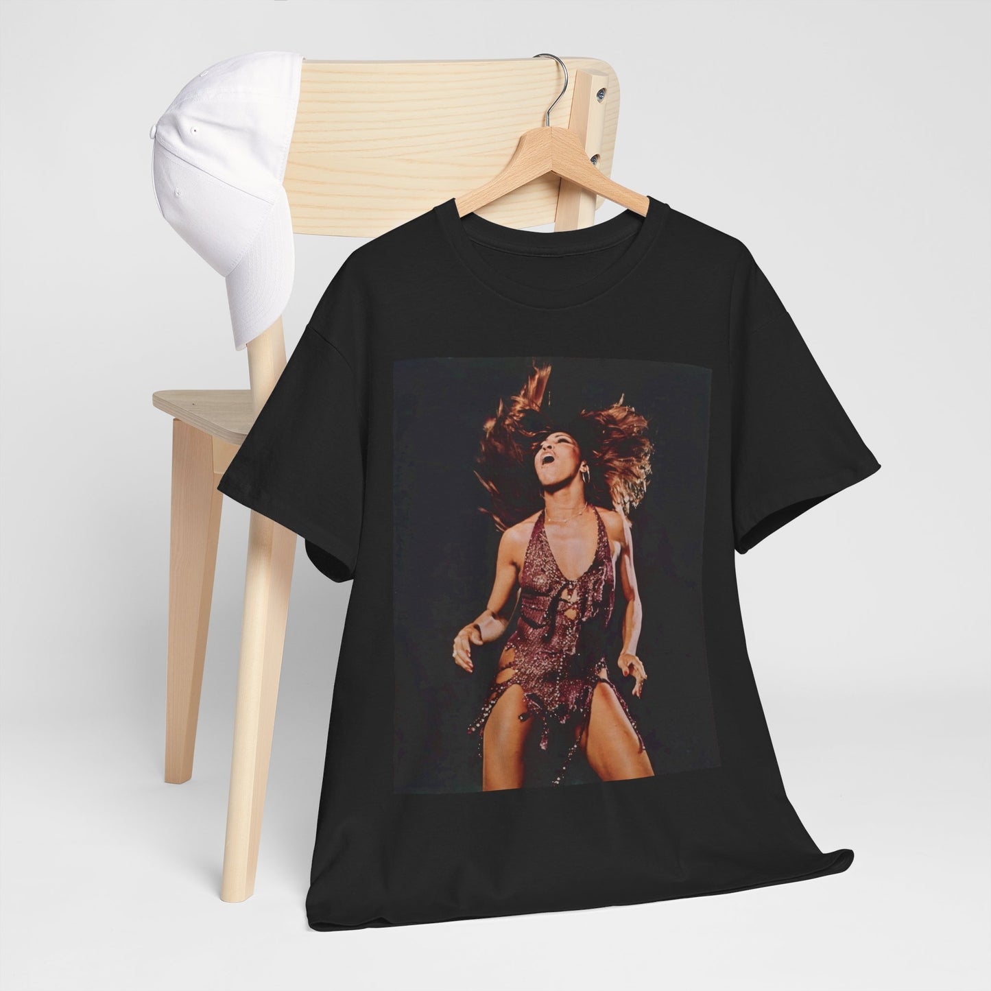 A black graphic t-shirt featuring an authentic live performance graphic of Tina Turner.