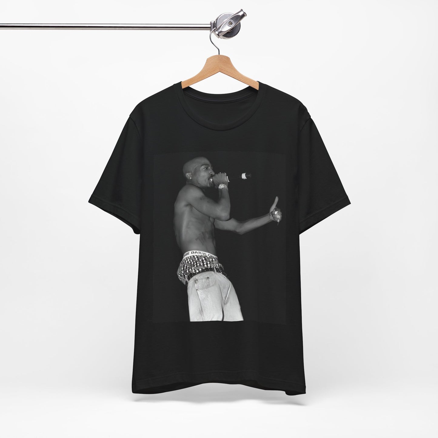 A black graphic t-shirt featuring a graphic of Tupac as a justice fighter.