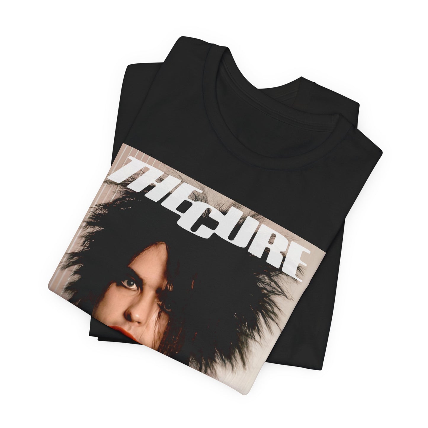A black graphic t-shirt featuring a 90s portrait photo of Robert Smith from The Cure.