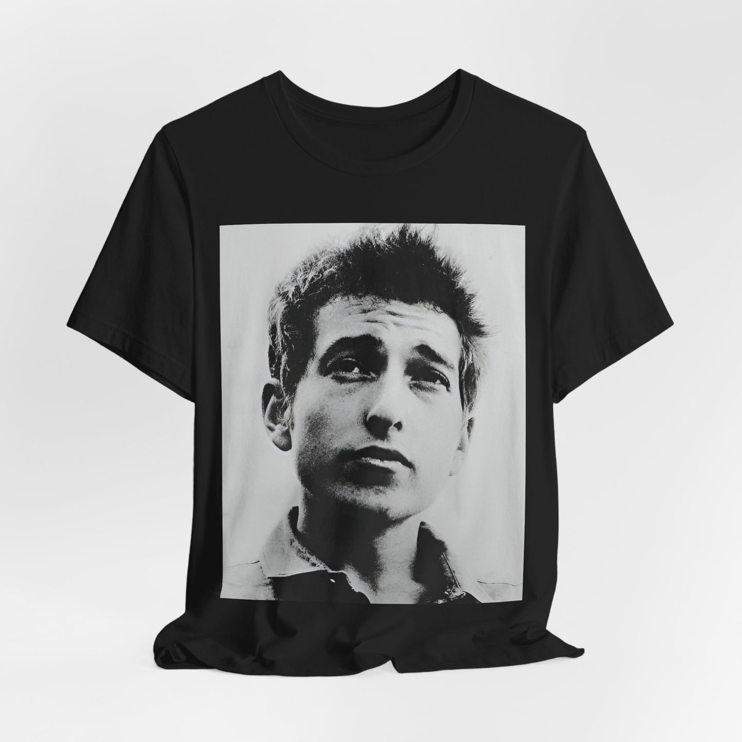 A black graphic t-shirt featuring a retro black and white folk iconic graphic of Bob Dylan.