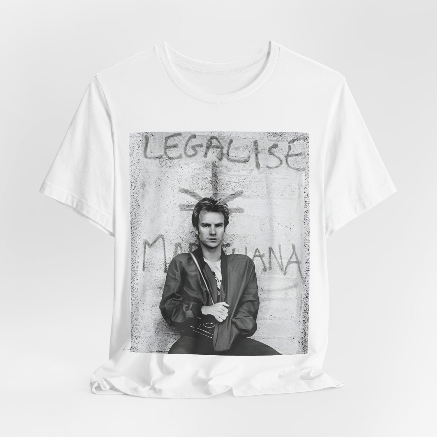 A black graphic t-shirt featuring a graphic of The Police with reggae-influenced pop elements.