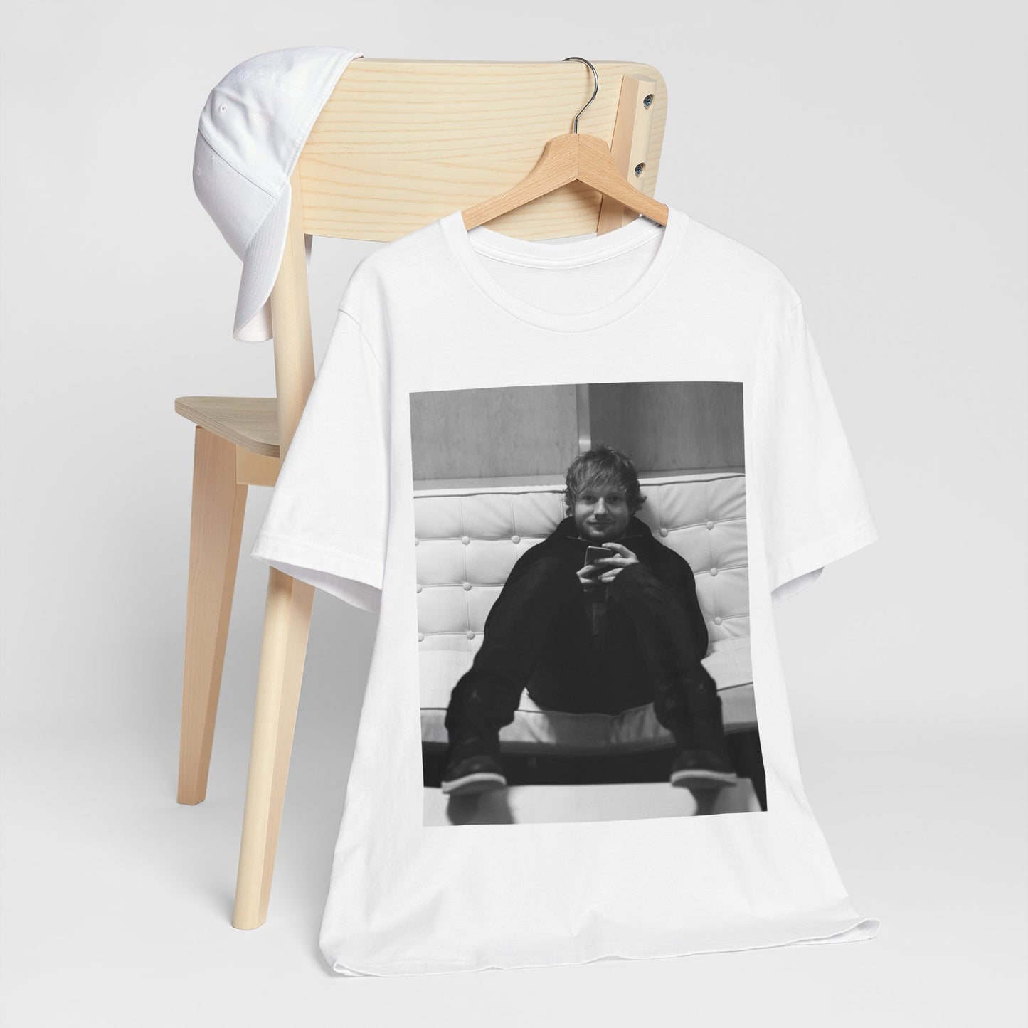 A black graphic t-shirt featuring a bold black and white graphic of Ed Sheeran.