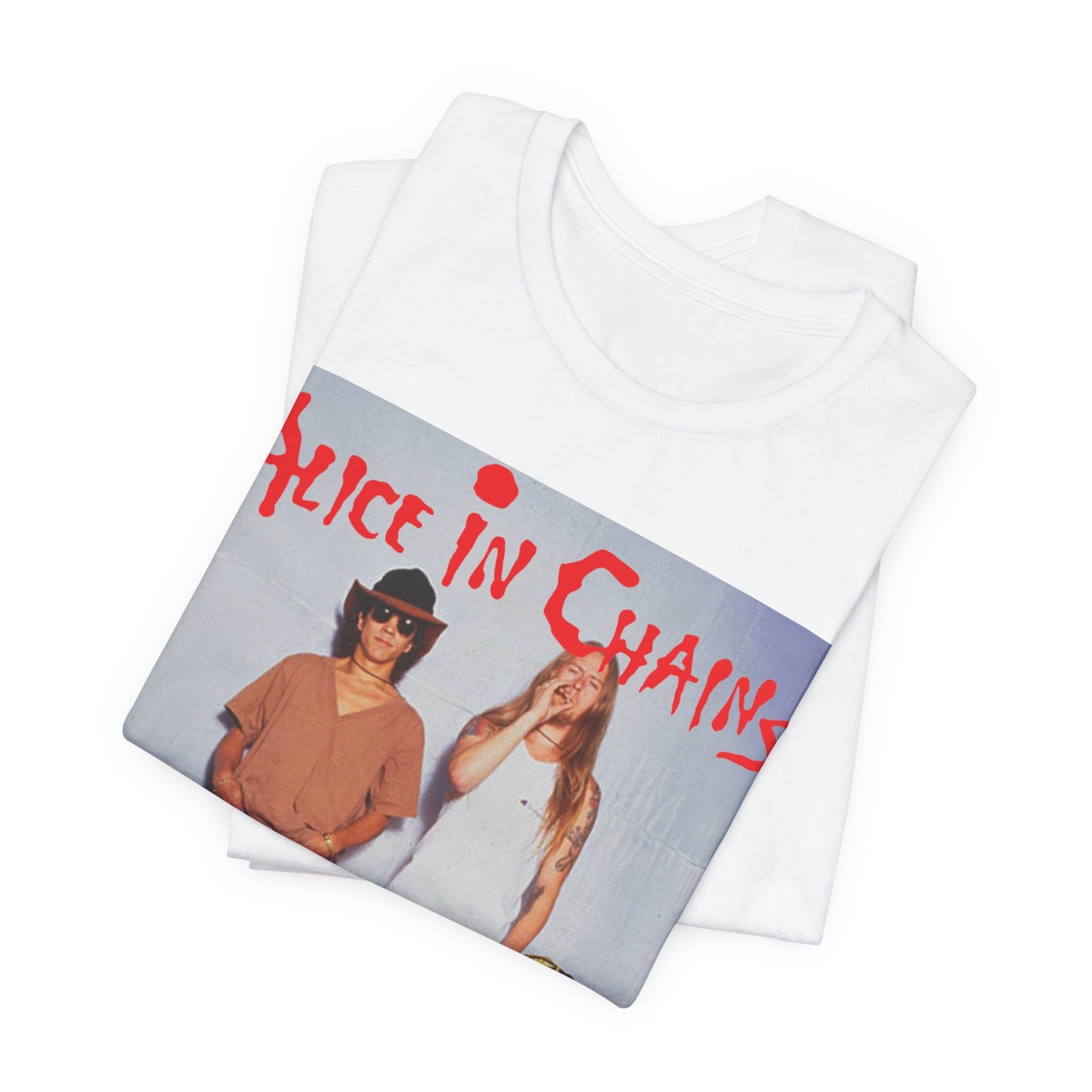 A black graphic t-shirt featuring a band graphic of Alice In Chains from 1990, capturing their early grunge aesthetic.