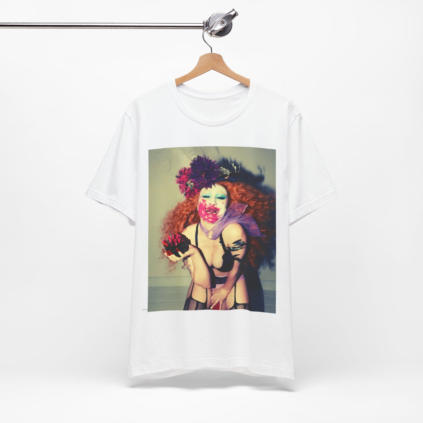 A black graphic t-shirt featuring a retro graphic related to Chappell Roan's 'Pink Pony Club' era.