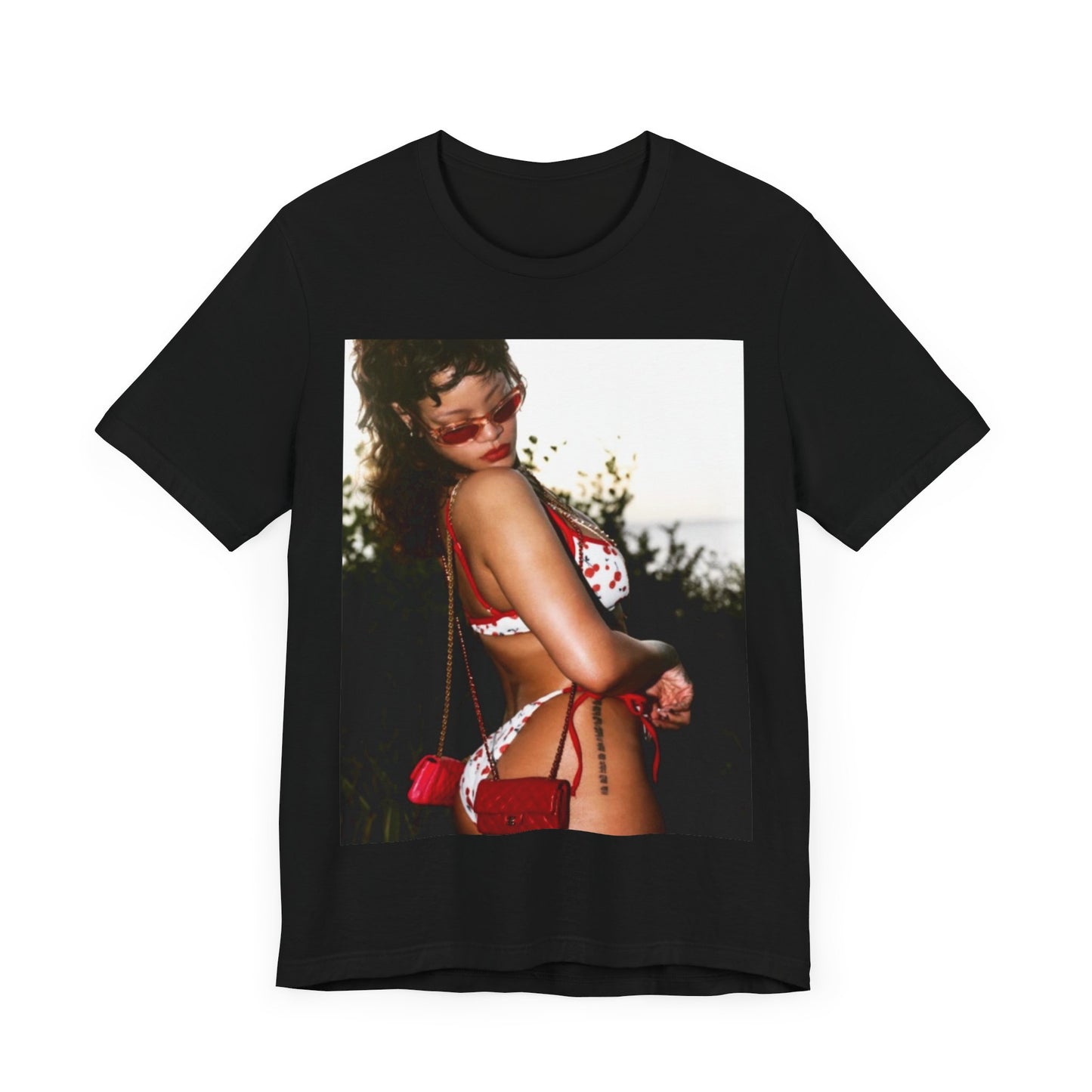 A black graphic t-shirt featuring a photo graphic of Rihanna in a bikini.