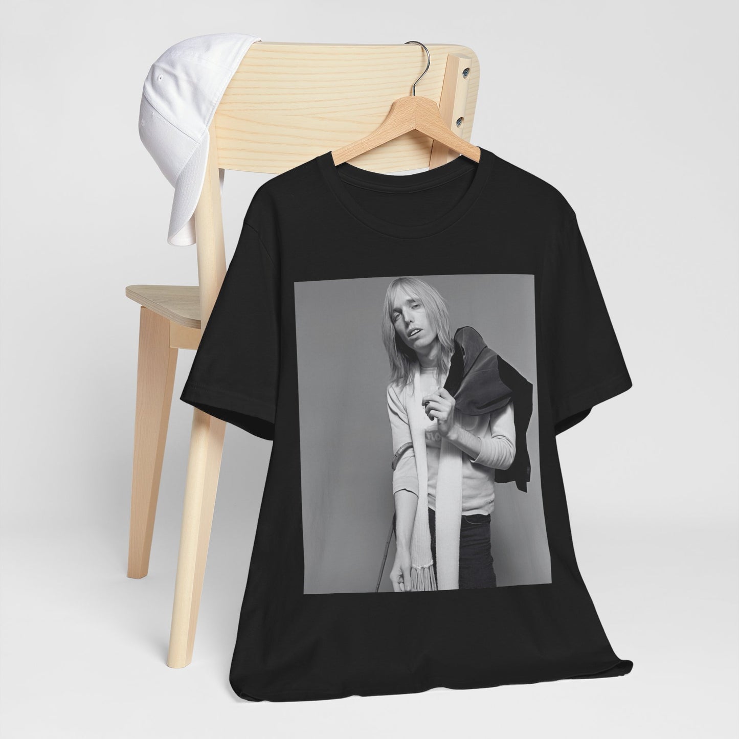 A black graphic t-shirt featuring a modern rock essential graphic of Tom Petty.