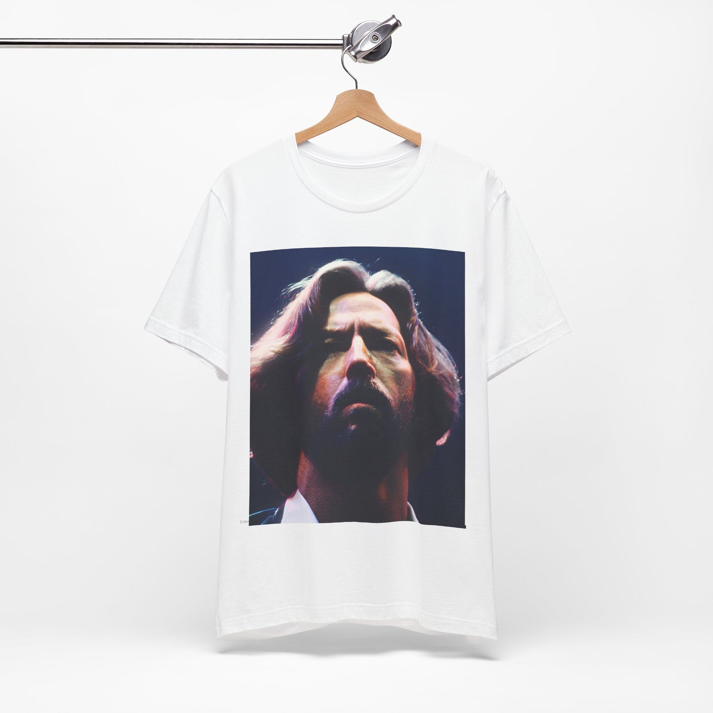 A black graphic t-shirt featuring a graphic related to Eric Clapton's 'Tears in Heaven' song or era.