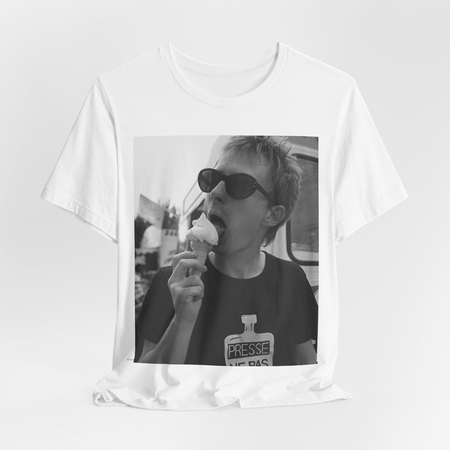 A black graphic t-shirt featuring a graphic of Thom Yorke from Radiohead with an ice cream cone.