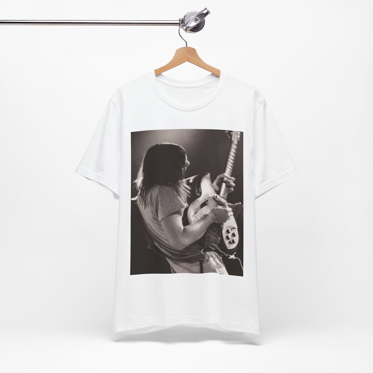 A black graphic t-shirt featuring a black and white graphic or photo of Tame Impala performing live on stage.