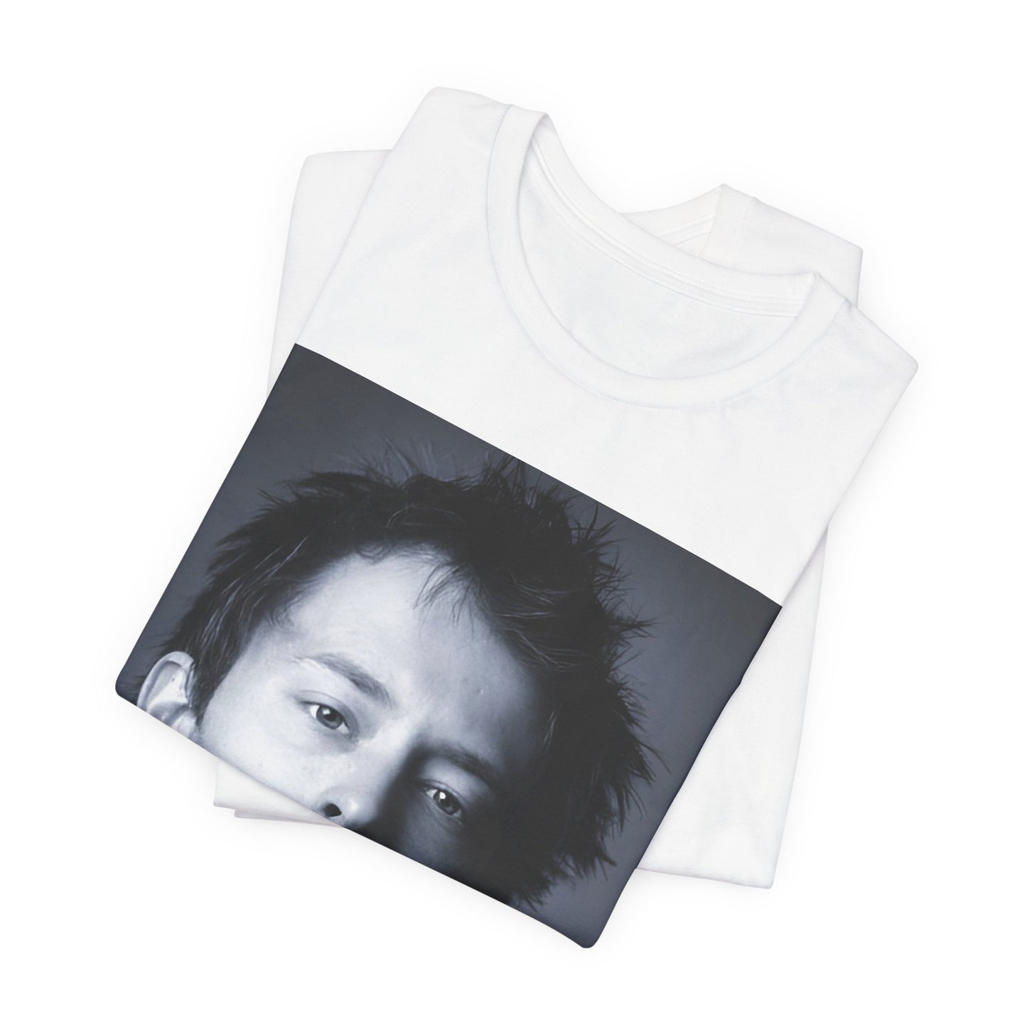A black graphic t-shirt featuring an enigmatic graphic of Thom Yorke from Radiohead as a frontman.