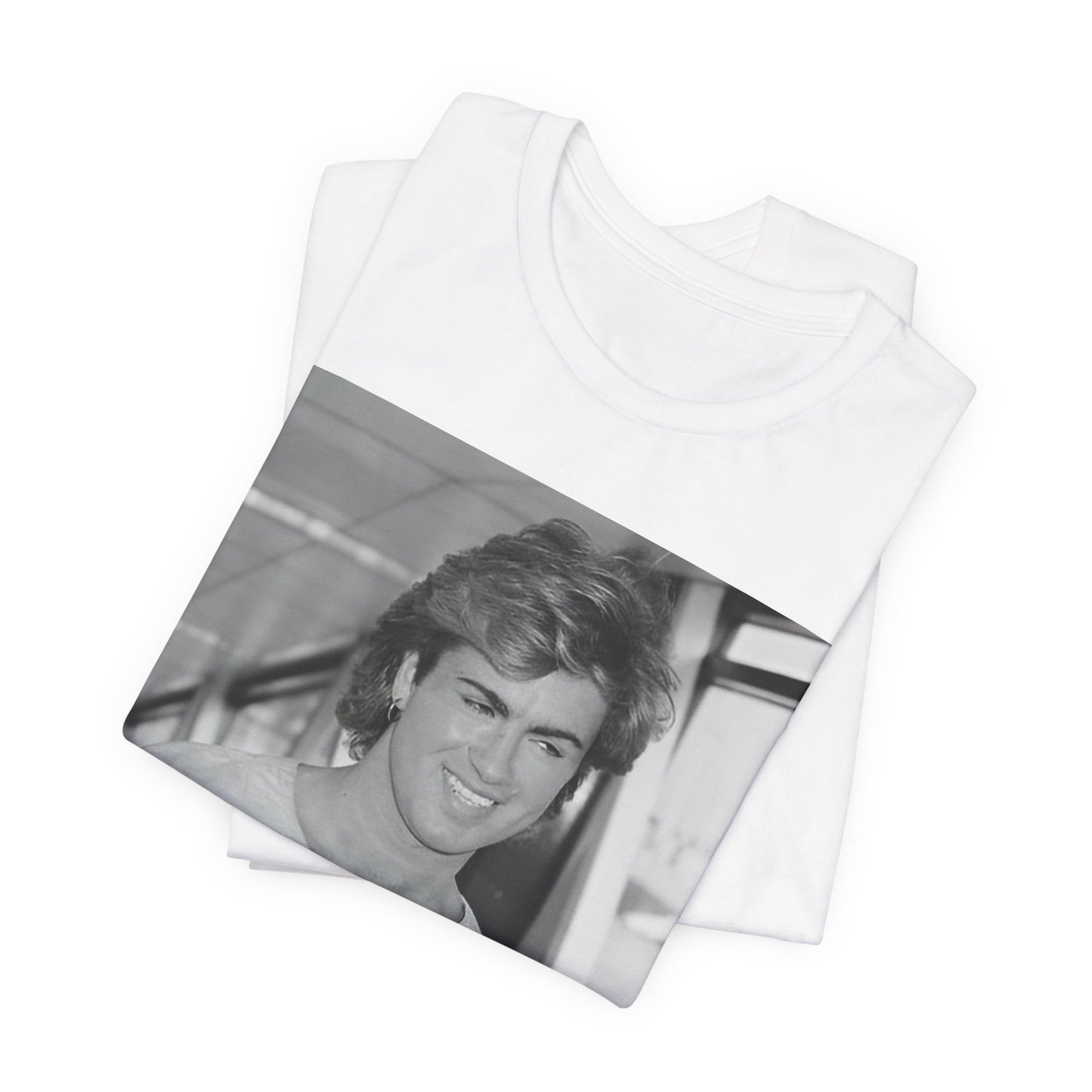 A black graphic t-shirt featuring an 80s black and white vintage photo or graphic of George Michael.