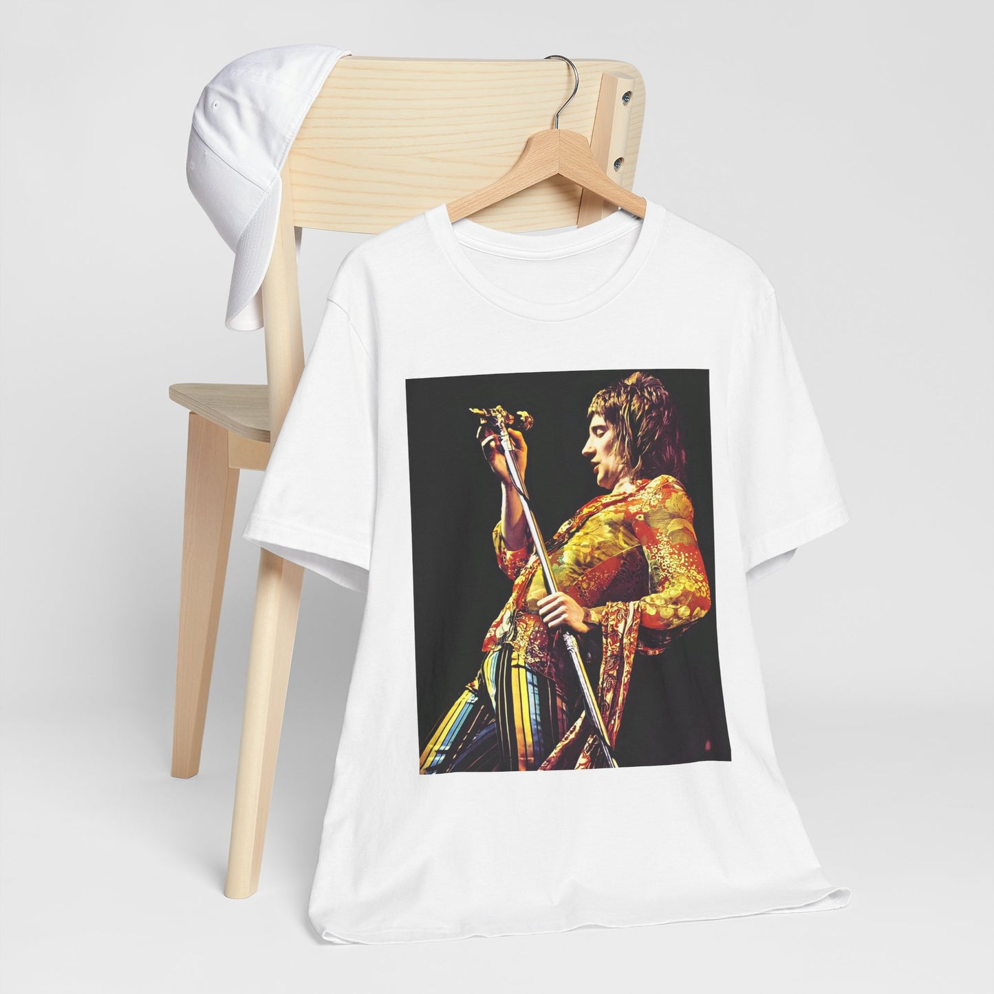 A black graphic t-shirt featuring a fierce graphic of Rod Stewart performing on stage from the 70s.