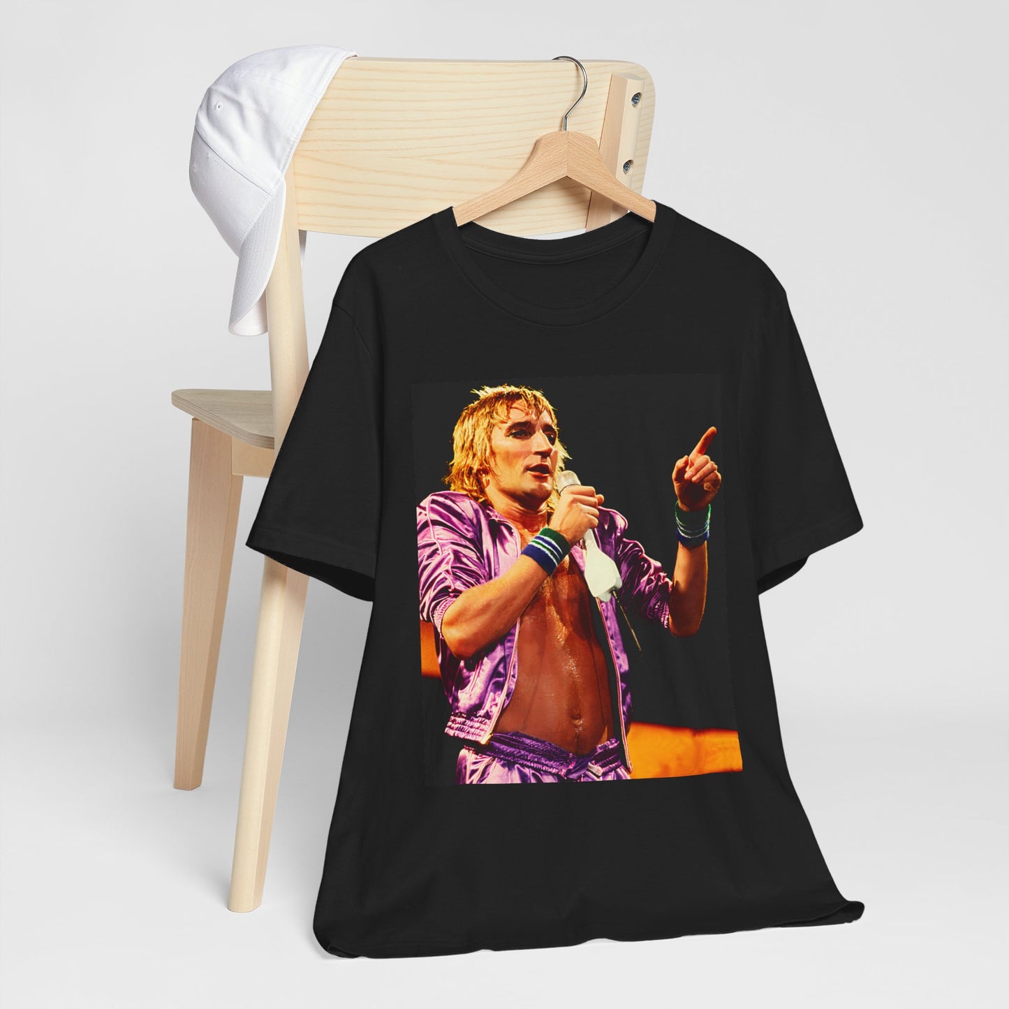 A black graphic t-shirt featuring a graphic of Rod Stewart with a chill 70s rock aesthetic.