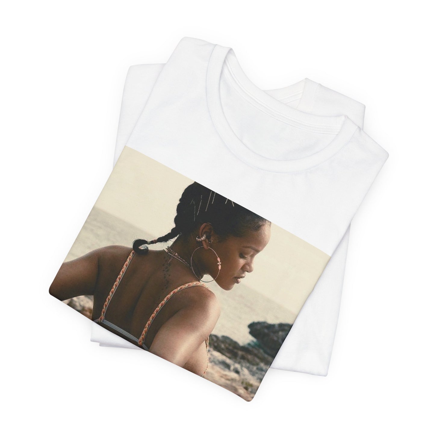 A black graphic t-shirt featuring a graphic of Rihanna as a bikini babe in paradise.