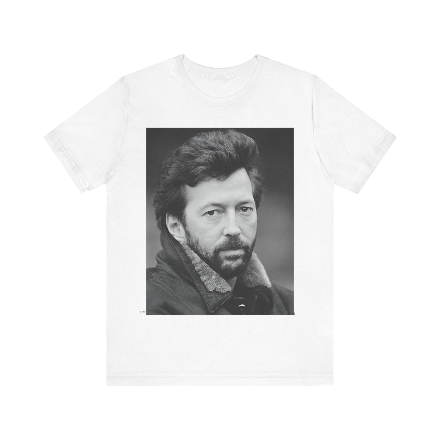 A black graphic t-shirt featuring a 70s rock aesthetic graphic of Eric Clapton.