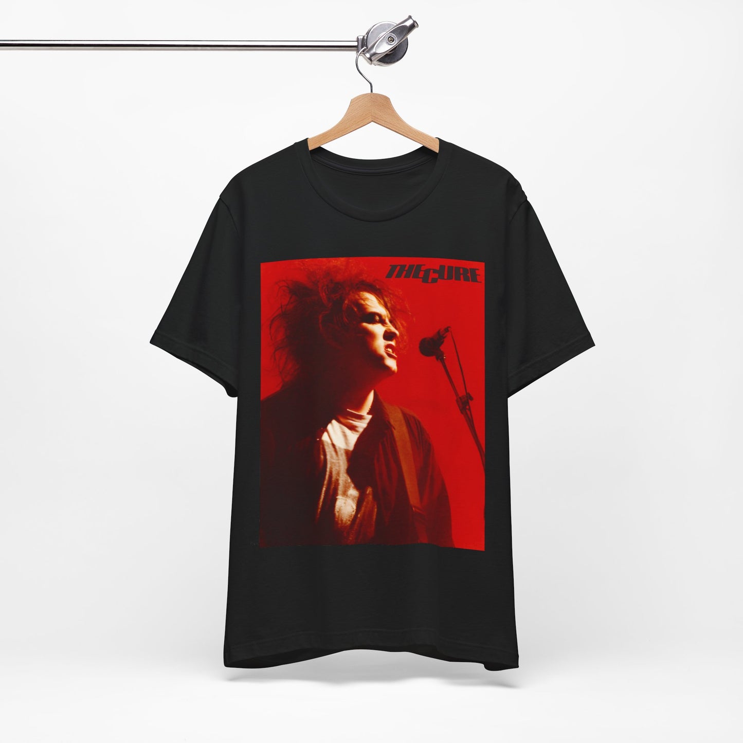 A black graphic t-shirt featuring a graphic of Robert Smith from The Cure with iconic red lipstick.