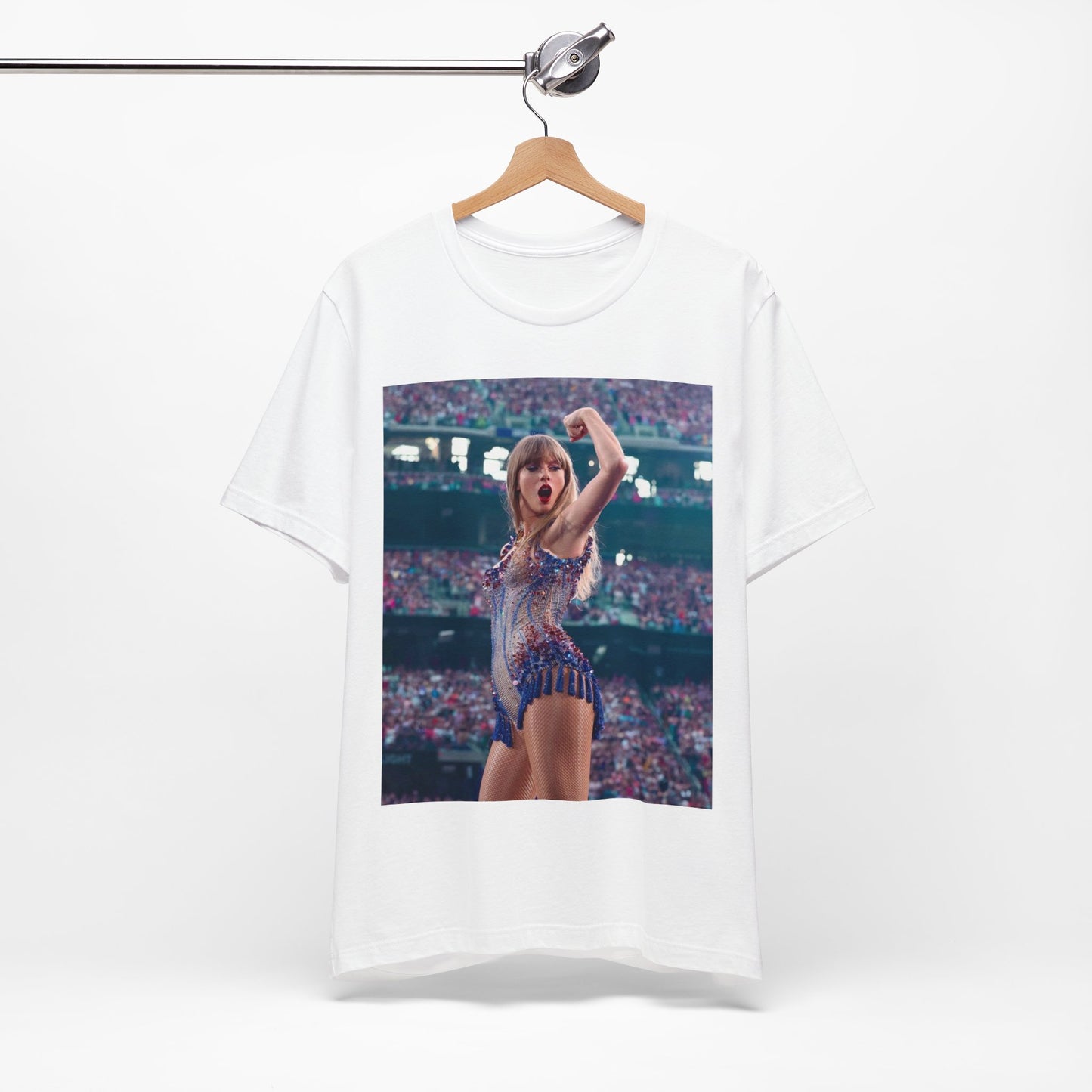 A black graphic t-shirt featuring a graphic or photo of Taylor Swift performing live on stage.