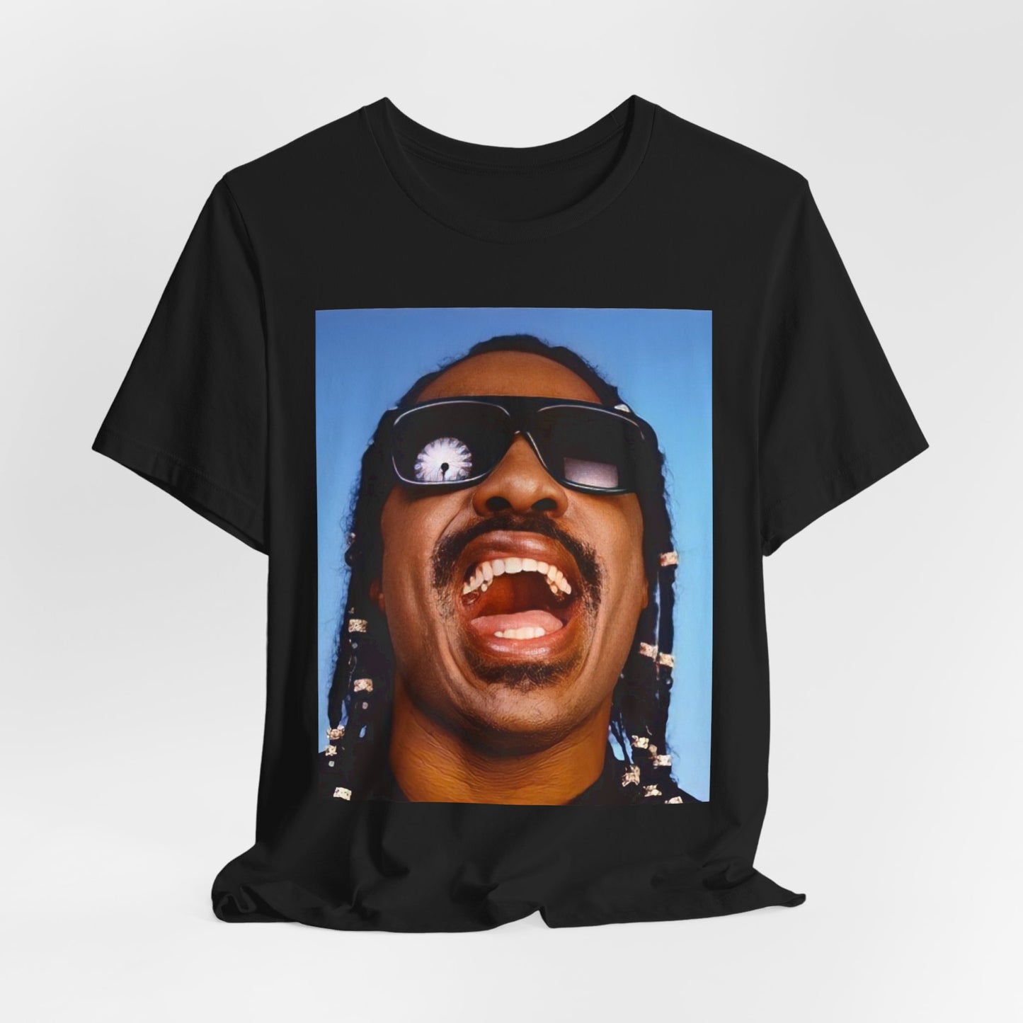 A black graphic t-shirt featuring a bold soul superstar graphic of Stevie Wonder.