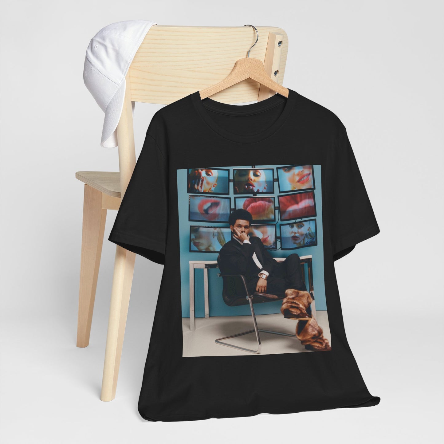 A black graphic t-shirt featuring an aesthetic graphic of The Weeknd.