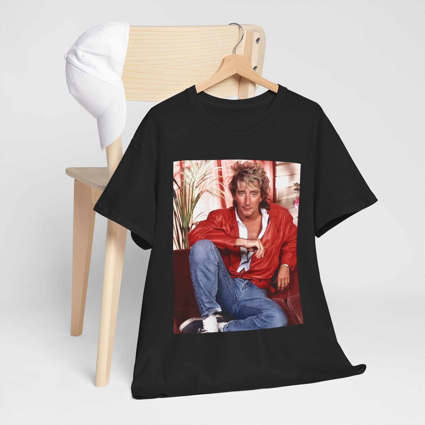 A black graphic t-shirt featuring an 80s global phenomenon graphic of Rod Stewart.
