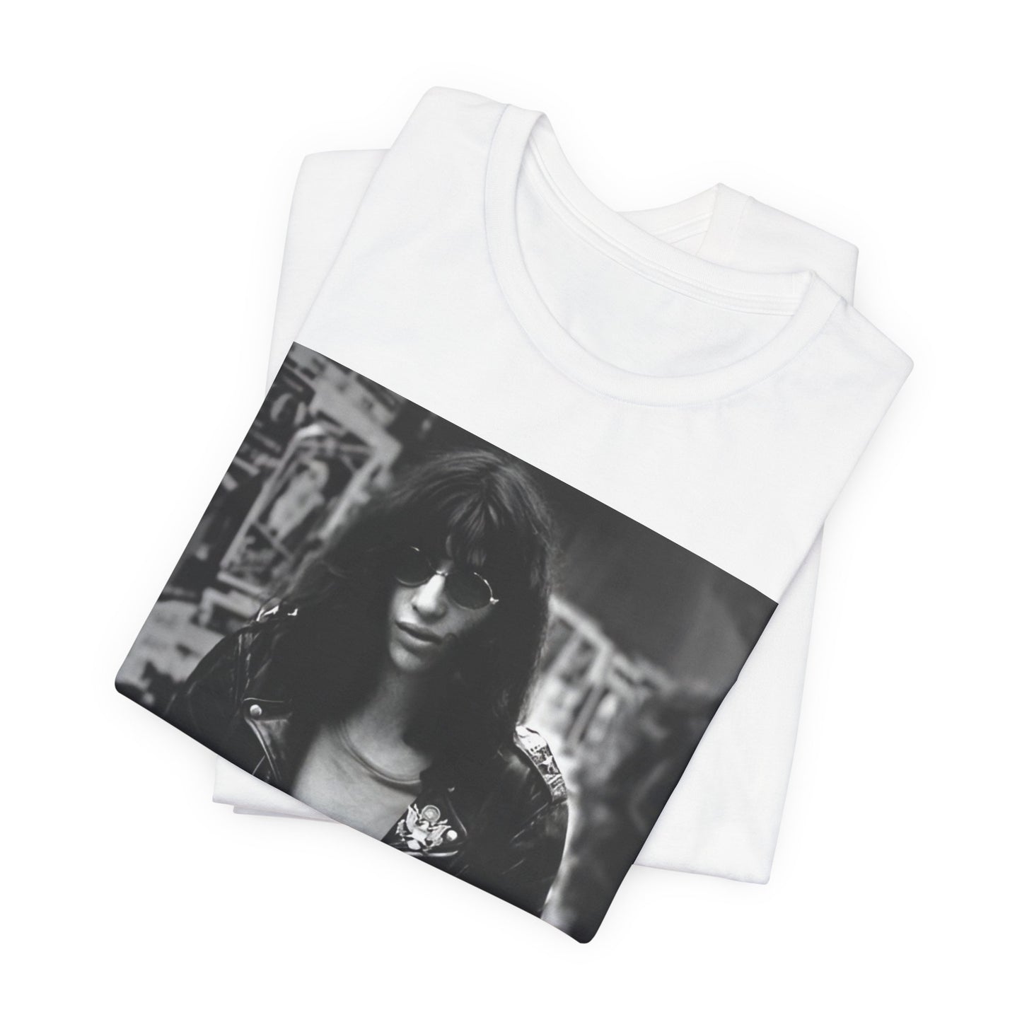 A black graphic t-shirt featuring a 70s black and white photo portrait of Joey Ramone from Ramones.