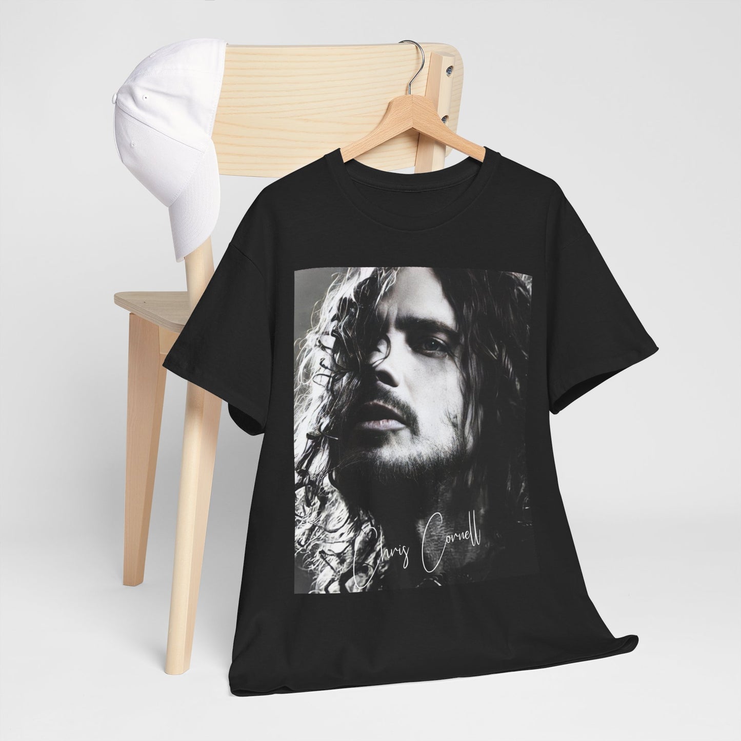 A black graphic t-shirt featuring a 90s black and white retro photo portrait of Chris Cornell.
