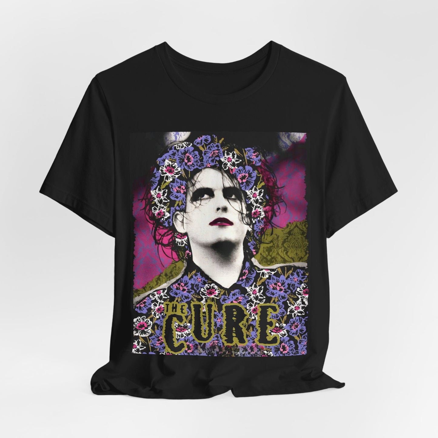 A black graphic t-shirt featuring a retro rock aesthetic pop art graphic of The Cure.