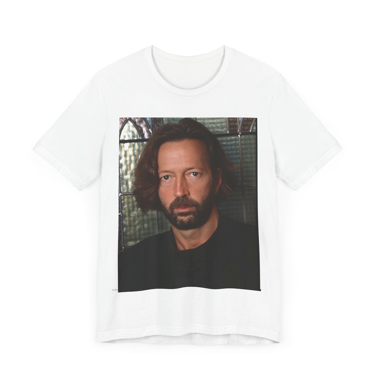 A black graphic t-shirt featuring a portrait graphic of Eric Clapton as a guitar god legend.