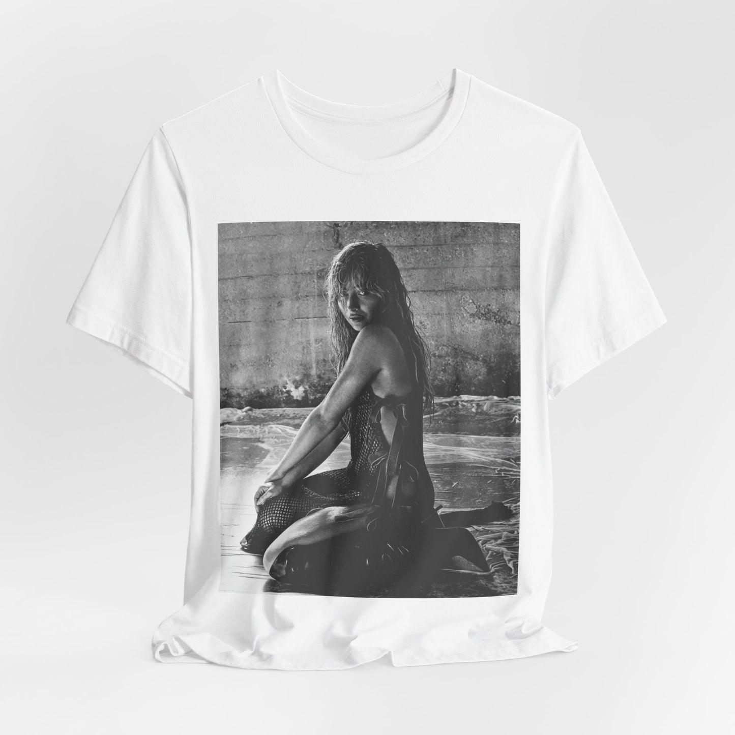 A black graphic t-shirt featuring a black and white, monochrome graphic or photo of Sabrina Carpenter.