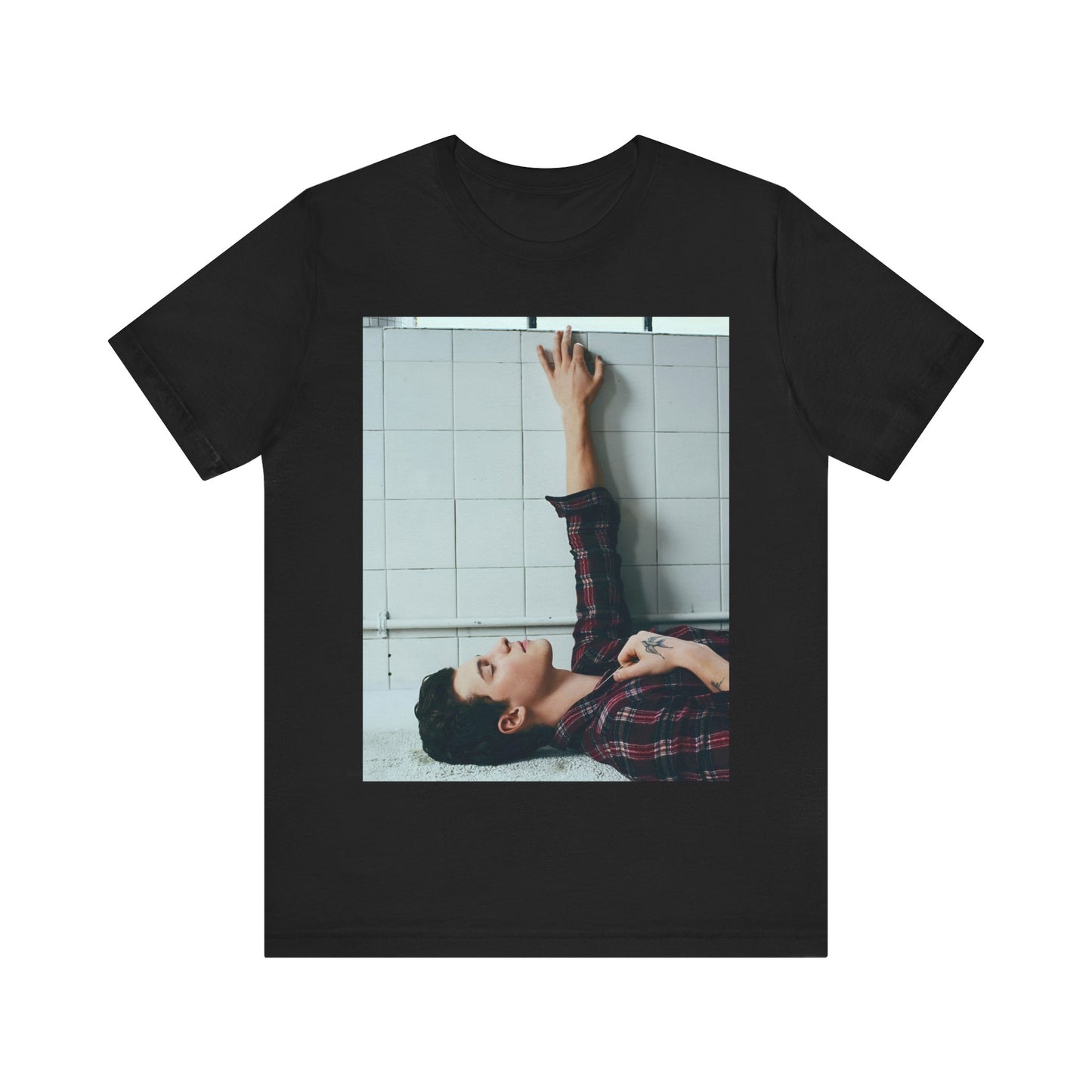 A black graphic t-shirt featuring a bold graphic of Shawn Mendes as a superstar.