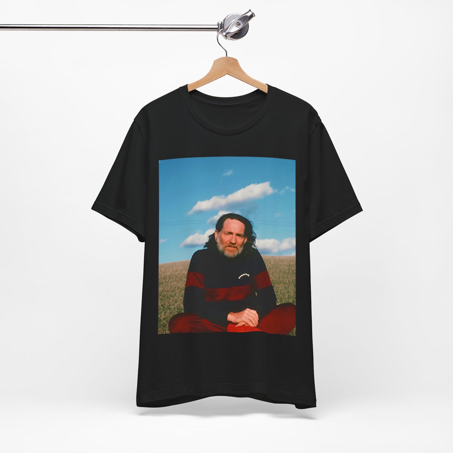 A black graphic t-shirt featuring a classic outlaw country graphic of Willie Nelson.