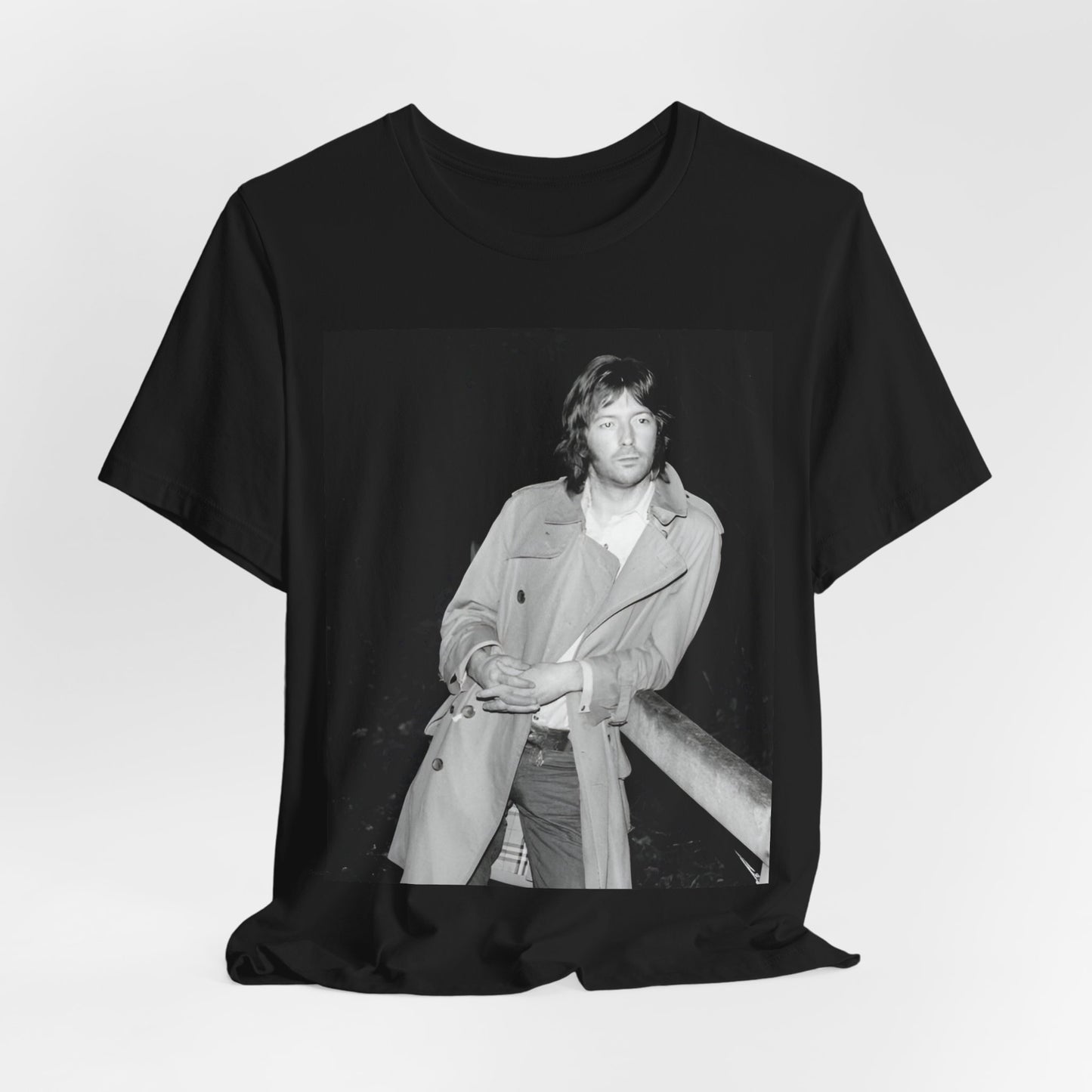 A black graphic t-shirt featuring a retro graphic of Eric Clapton as a blues master.