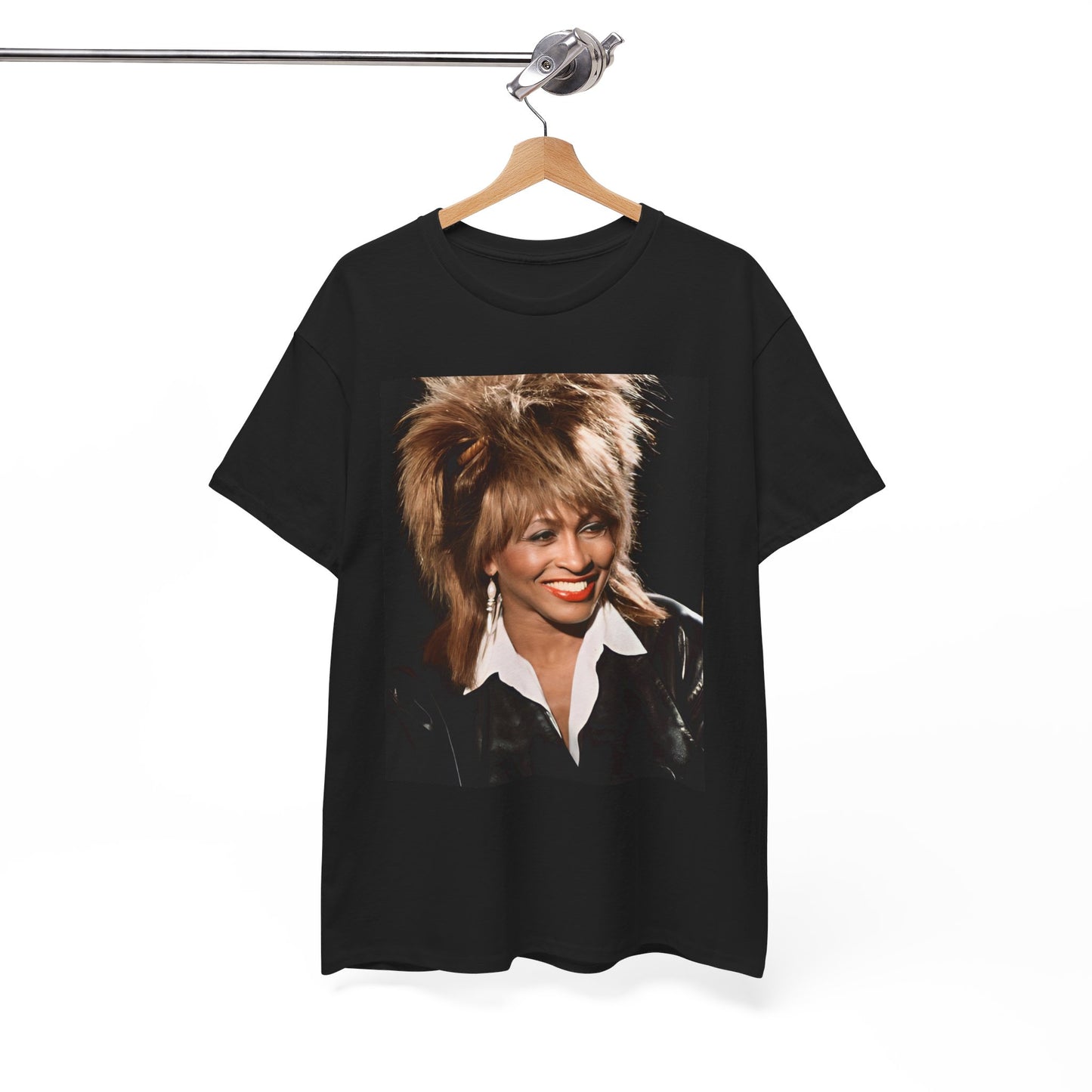 A black graphic t-shirt featuring a nostalgic graphic of Tina Turner as the Queen of Rock.
