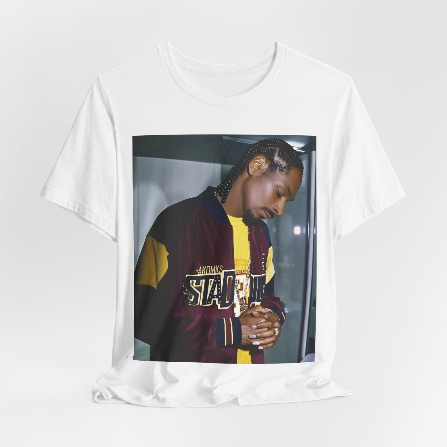 A black graphic t-shirt featuring a classic graphic of Snoop Dogg with a cool gaze.