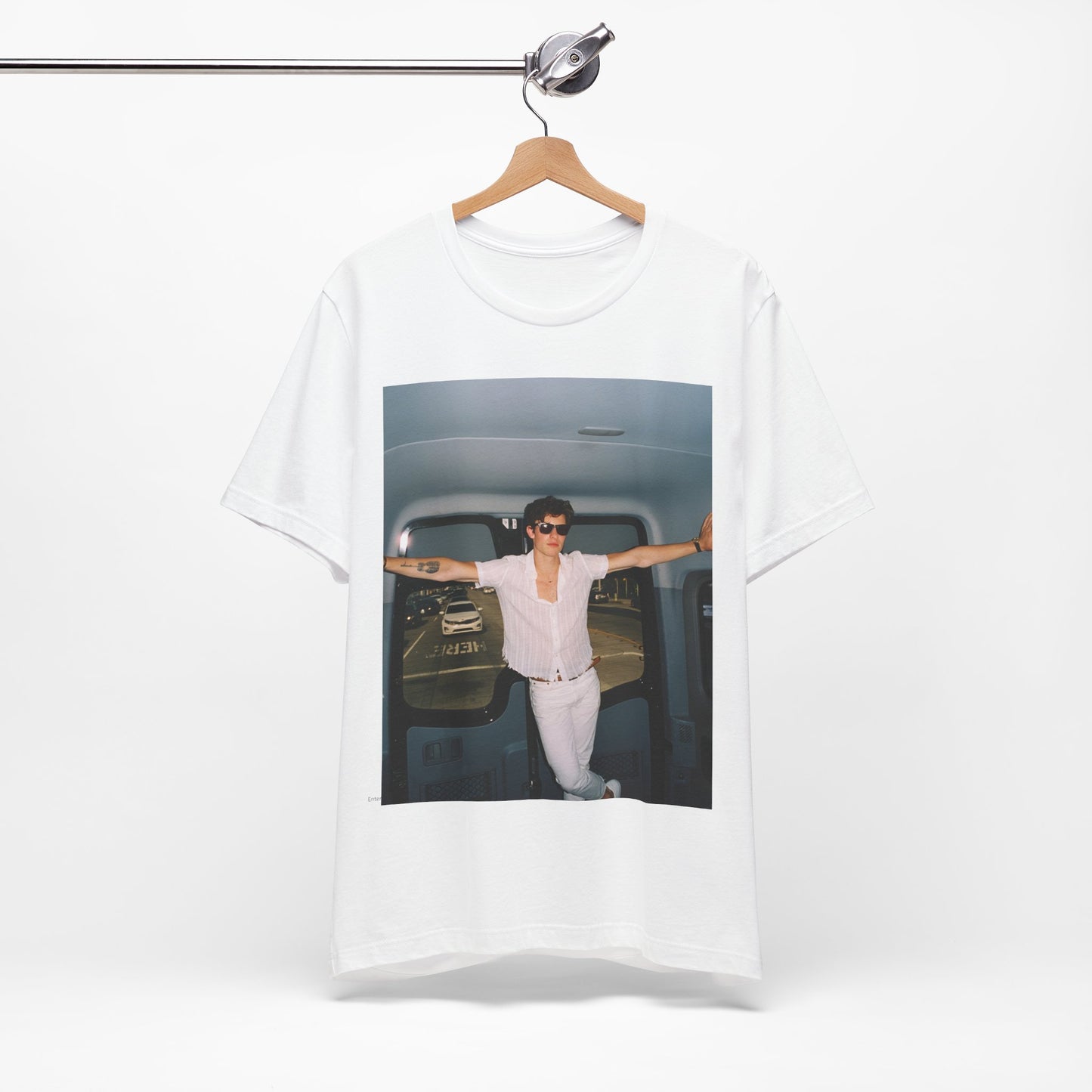A black graphic t-shirt featuring a graphic of Shawn Mendes with a classic confident look.