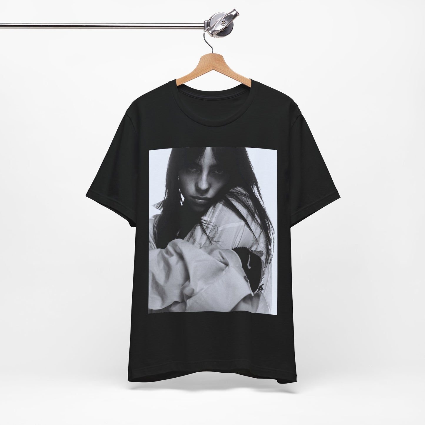Billie Eilish posing in her signature oversized designer streetwear, printed on a graphic t-shirt.
