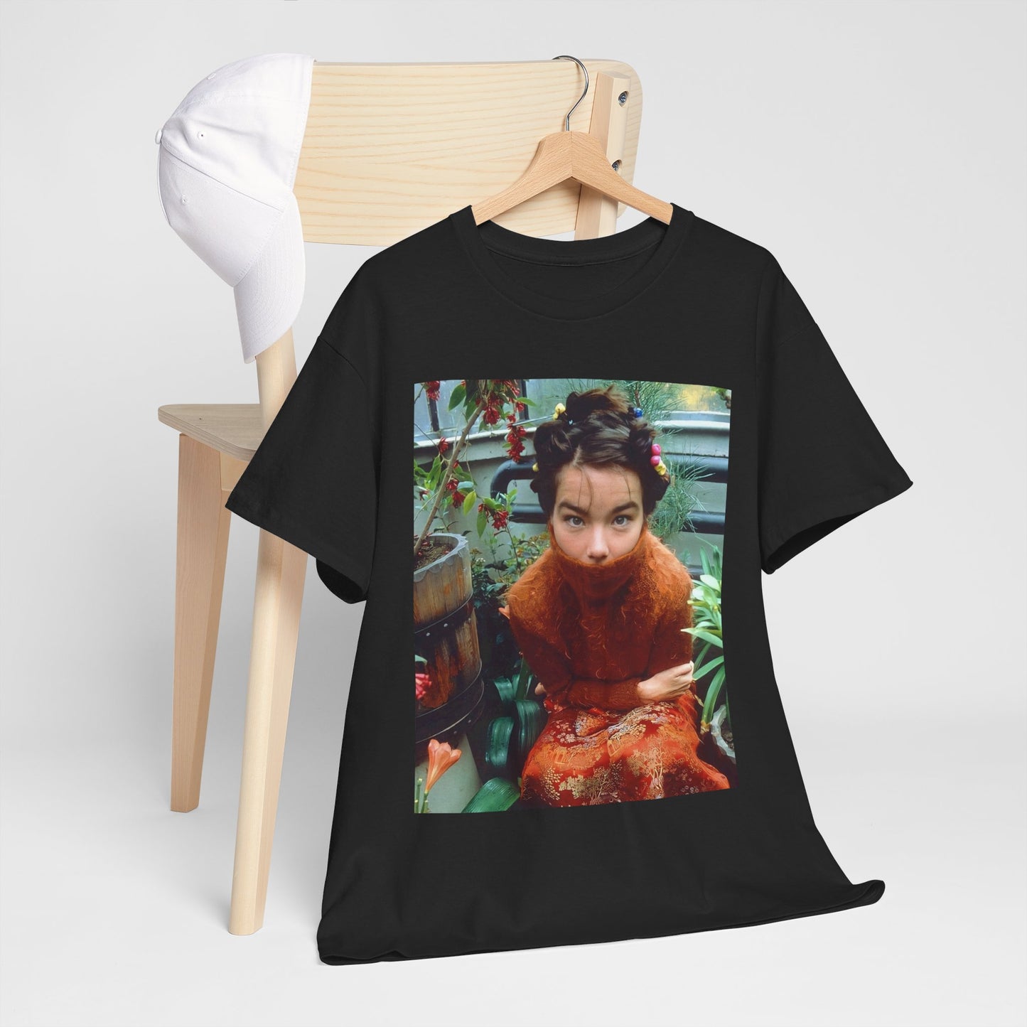 A black graphic t-shirt featuring a dynamic and 'fierce' graphic of Bjork, emphasizing her strong and confident presence.
