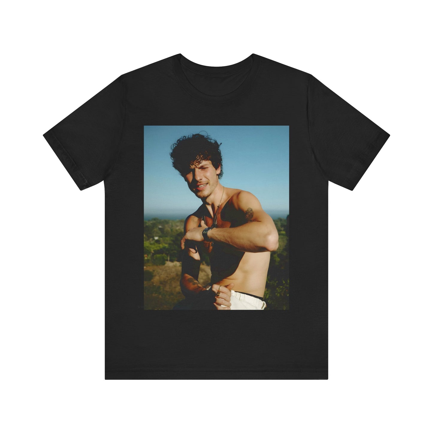 A black graphic t-shirt featuring a graphic of Shawn Mendes with a chill pop star look.