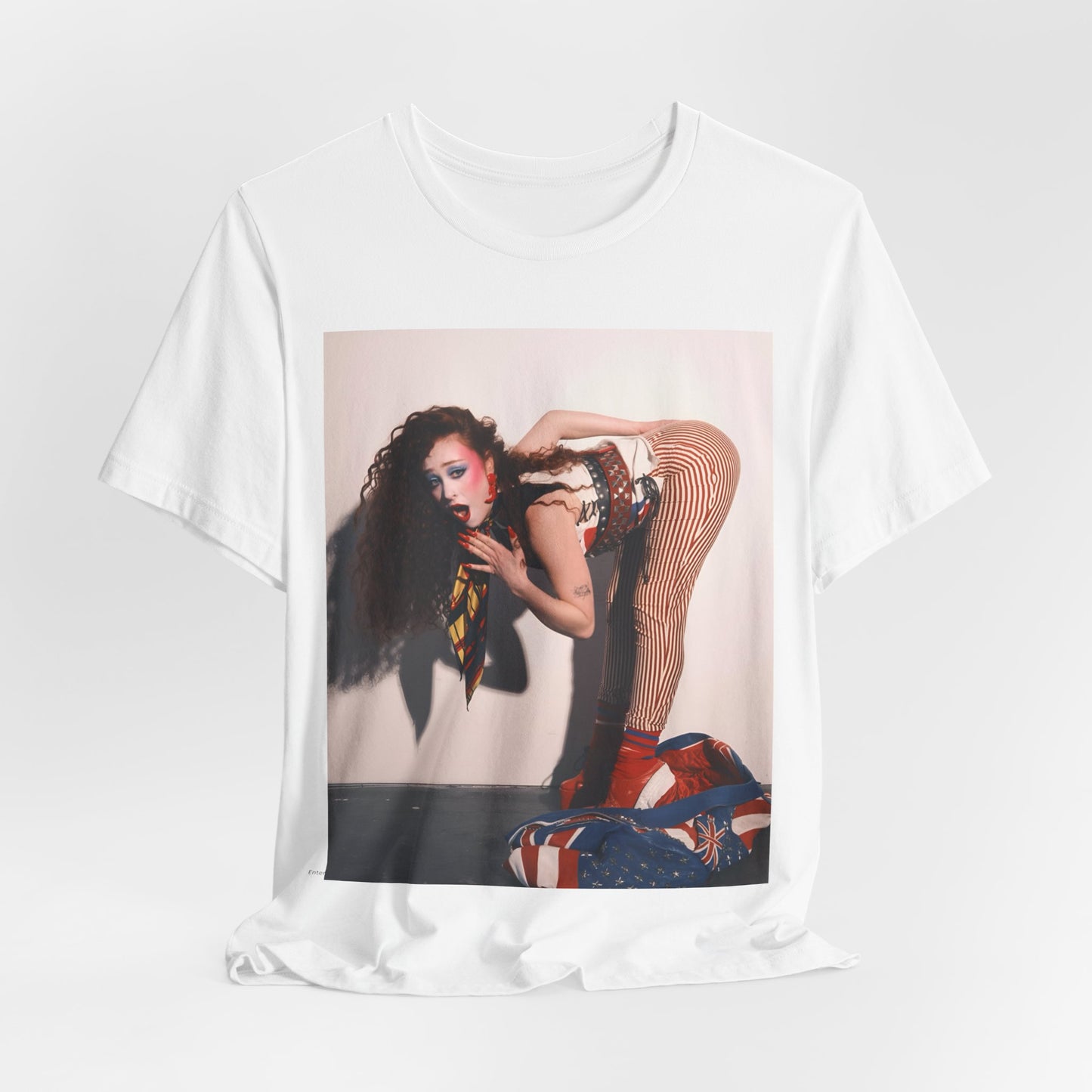 A black graphic t-shirt featuring a graphic of Chappell Roan with a 'Hot to Go!' theme, emphasizing her drag icon persona.