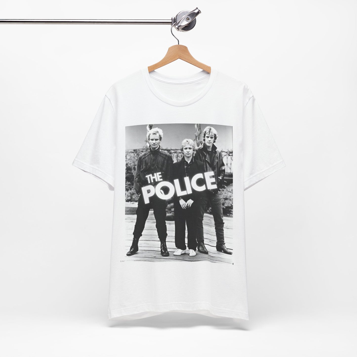 A black graphic t-shirt featuring an 80s pop rock aesthetic black and white graphic of The Police.