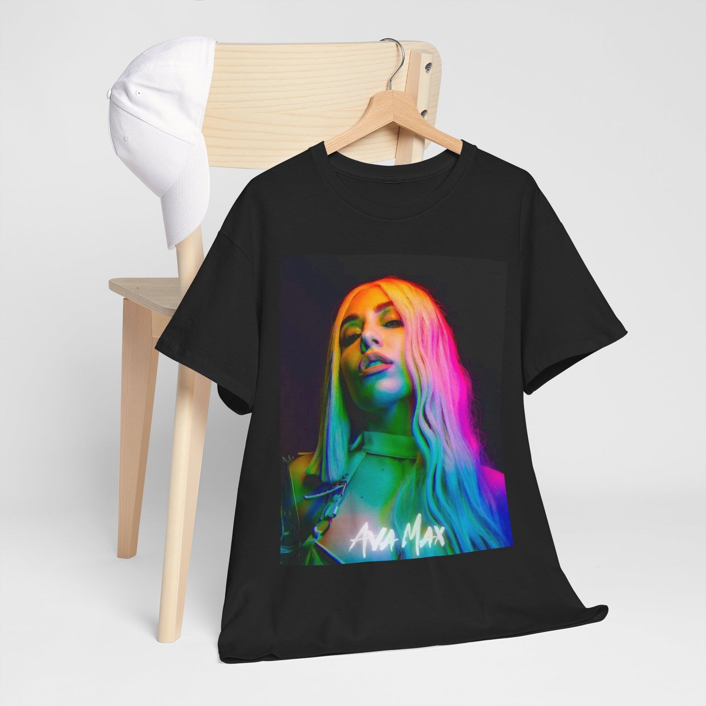 A black graphic t-shirt featuring a graphic of Ava Max with a rainbow or colorful glow effect around her.