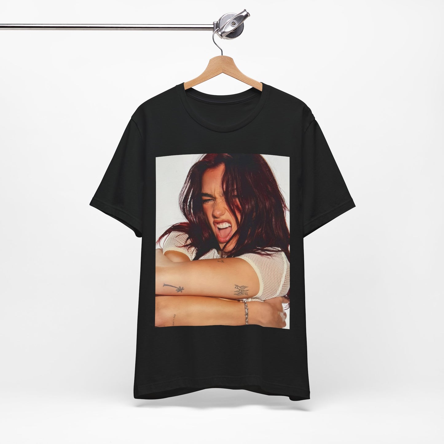 A black graphic t-shirt featuring a bold disco pop graphic of Dua Lipa as a superstar.
