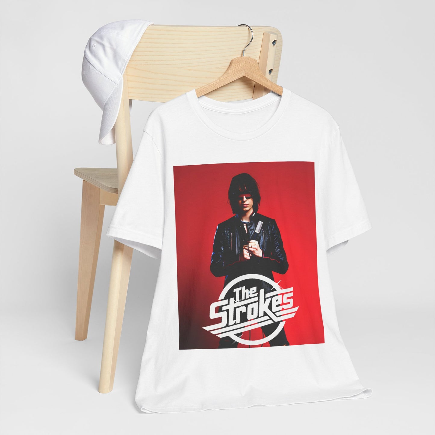 A black graphic t-shirt featuring a bold indie rock superstar graphic of The Strokes.