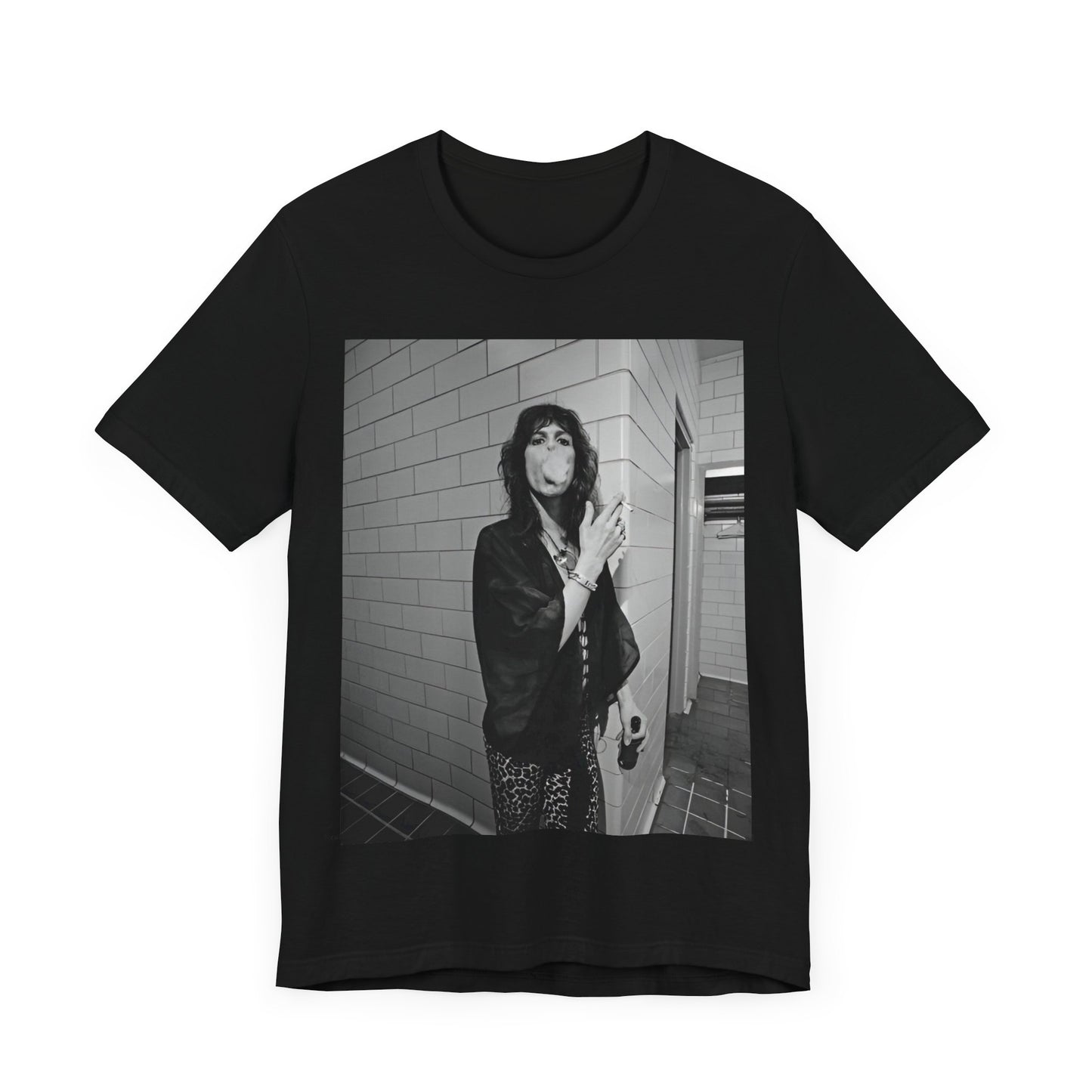 A black graphic t-shirt featuring a retro 70s photo of Aerosmith band members in a backstage setting, showing a candid moment.