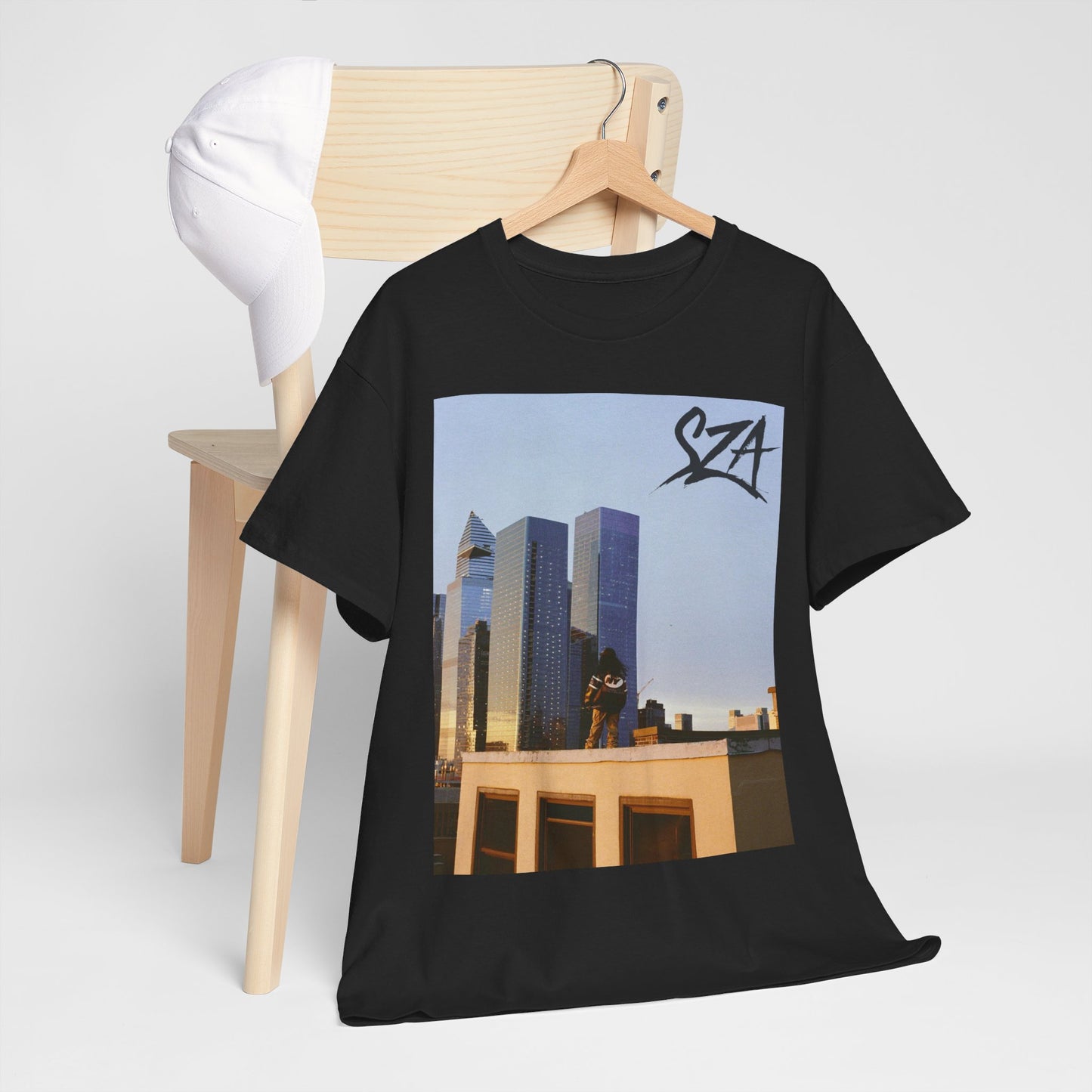 A black graphic t-shirt featuring a modern R&B essential graphic of SZA.